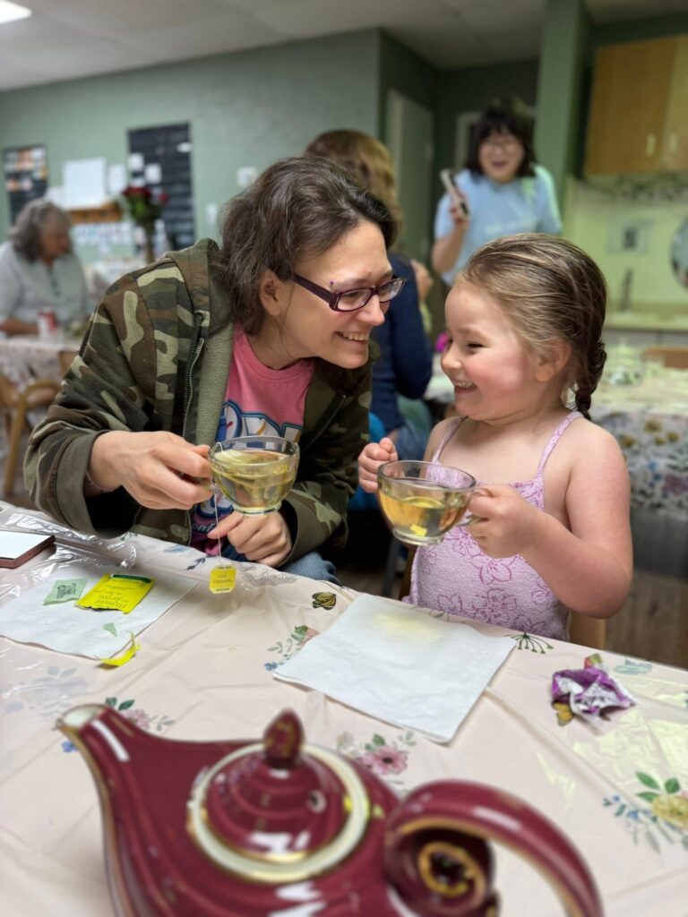 Mom and daughter sharing tea at the Mother's Day Tea Party