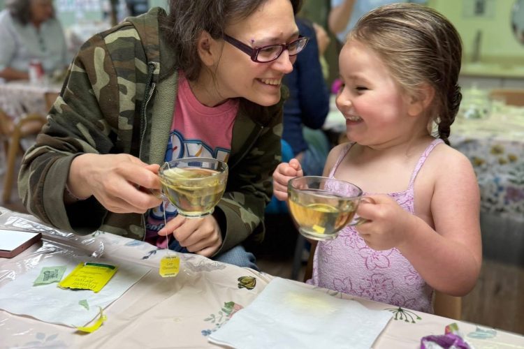 Mom and daughter sharing tea at the Mother's Day Tea Party
